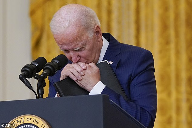 President Joe Biden pauses as he listens to a question about the Kabul airport bombings that killed at least 12 U.S. service members, from the East Room of the White House, Thursday, Aug. 26, 2021.