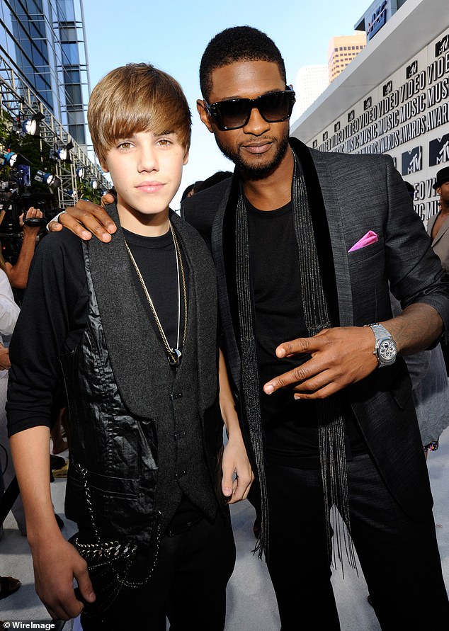 Usher is in talks with his former mentee Justin Bieber to make a surprise appearance at Sunday's Super Bowl halftime show (pictured in 2010).