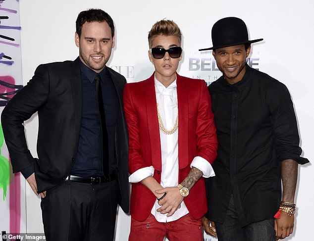 Usher signed him to their new joint venture in 2008, along with talent manager Scooter Braun, and the pair collaborated on Somebody to Love, the second single from Justin's first studio album, My World 2.0.  (pictured in 2013)
