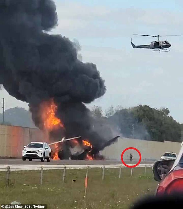 Video footage captured by the drivers shows the aftermath of the crash, revealing burning flames emanating from the plane while a brave bystander is seen running into the smoke.