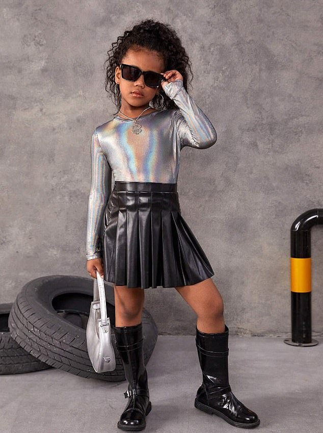 A young woman models a silver bodysuit and a pleated leather miniskirt on the brand's website.