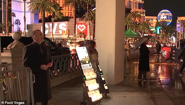 Michael Federico and his wife Tanya stood on the iconic Strip next to illuminated magazine racks filled with brochures containing information about the 
