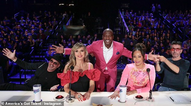 Cowell with fellow America's Got Talent judges Howie Mandel, Heidi Klum, Mel B and host Terry Crews