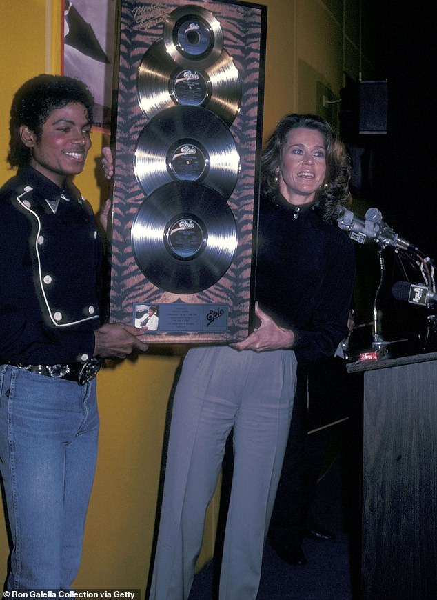Thriller achieved the milestone of being the first album to be certified 30 times platinum;  Pictured with Jane Fonda in 1982.