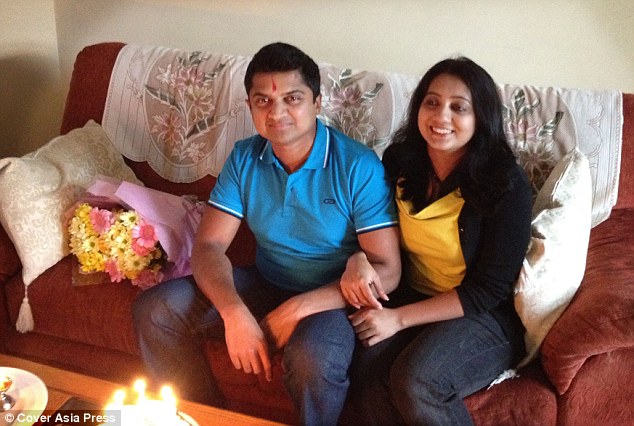 Devastated: Praveen Halappanavar (pictured with his wife Savita at their home in Galway) says he watched helplessly as she died from blood poisoning due to a miscarriage after doctors refused to perform an abortion.