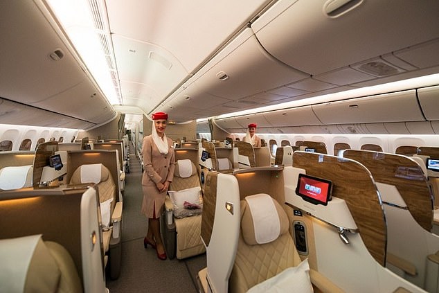Frequent flyer clubs are worth joining and most will allow you to redeem points for an upgrade. Pictured: Business class cabin on an Emirates flight, considered the third best airline for business travel.