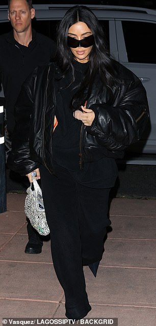 Kim easily carried a $6,950 Balenciaga mesh bag containing rhinestone details in her right hand.