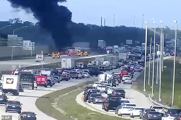 Black smoke billows from crash as cars get stuck in hours-long traffic jam