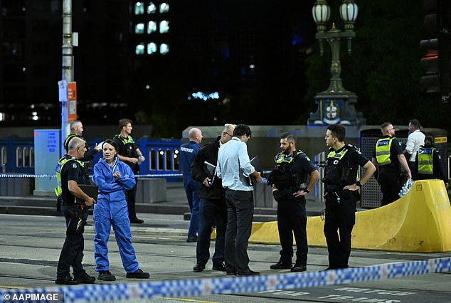 Two separate incidents merged around Princes Bridge, near Flinders Street station, with officers and emergency crews remaining at the scene (pictured) well into the night.