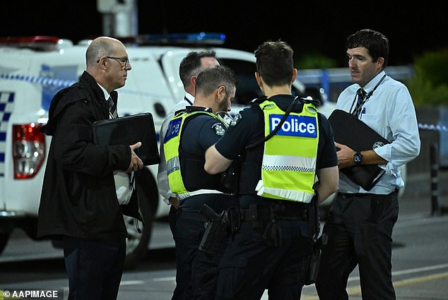 Several victims were injured when, in another incident, a man allegedly attacked four people, while another man allegedly threatened to harm a PSO with a glass bottle (pictured, investigators and police officers at the scene at Princes Bridge on Friday night).
