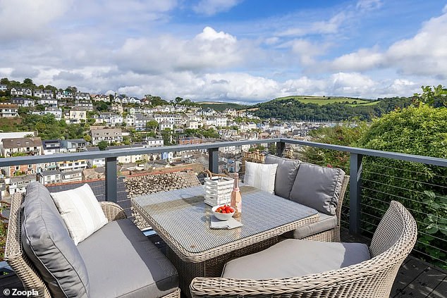 The house has a beautiful terrace with dining space and panoramic views.