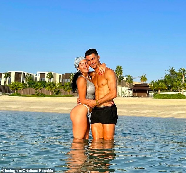 Ronaldo and Georgina pose for a photo in the sea during their break in the sun in Dubai