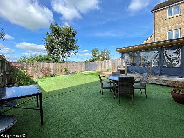Bannister said he laid the artificial grass (pictured) because it was 