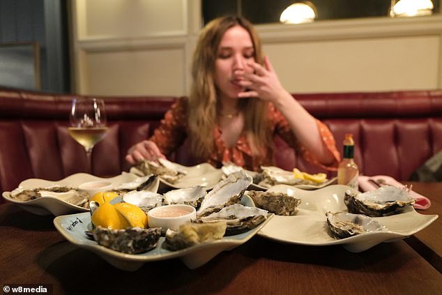 Kartik and Elmira enjoyed dinner from Burger & Lobster, and Elmira picked her way through 48 oysters.