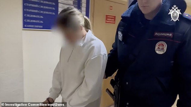 Agafonova is taken to the police station in handcuffs. She is accused of 