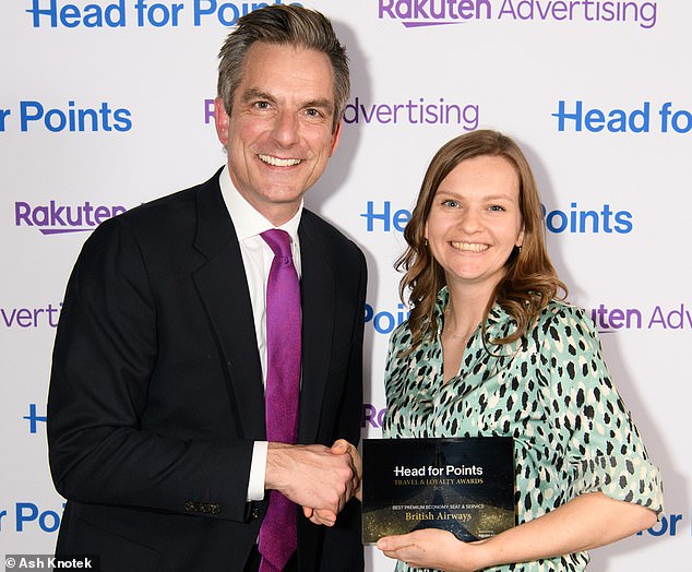 Sky News' Jonathan Samuels awards 'Best Loyalty Programme' to British Airways' Esme Fillingham at Head for Points Travel and Loyalty Awards