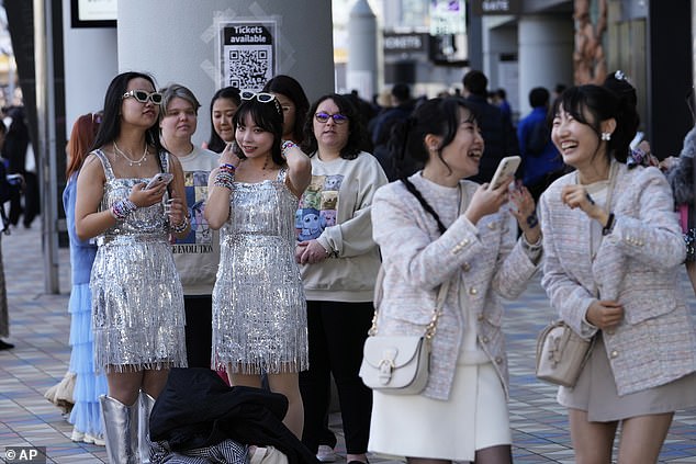 Fans line up outside Swift's fourth and final Eras Tour show in Tokyo on Saturday night.