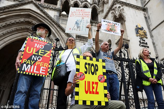 Anti-ULEZ protesters demonstrate outside the Royal Courts of Justice ahead of the ruling on the extension of London's clean air zone.
