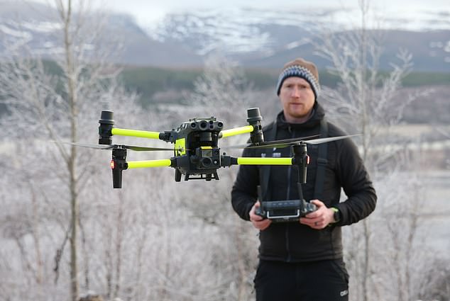 Mountain rescue team member Jonny Porteous uses drone to search for escaped monkey