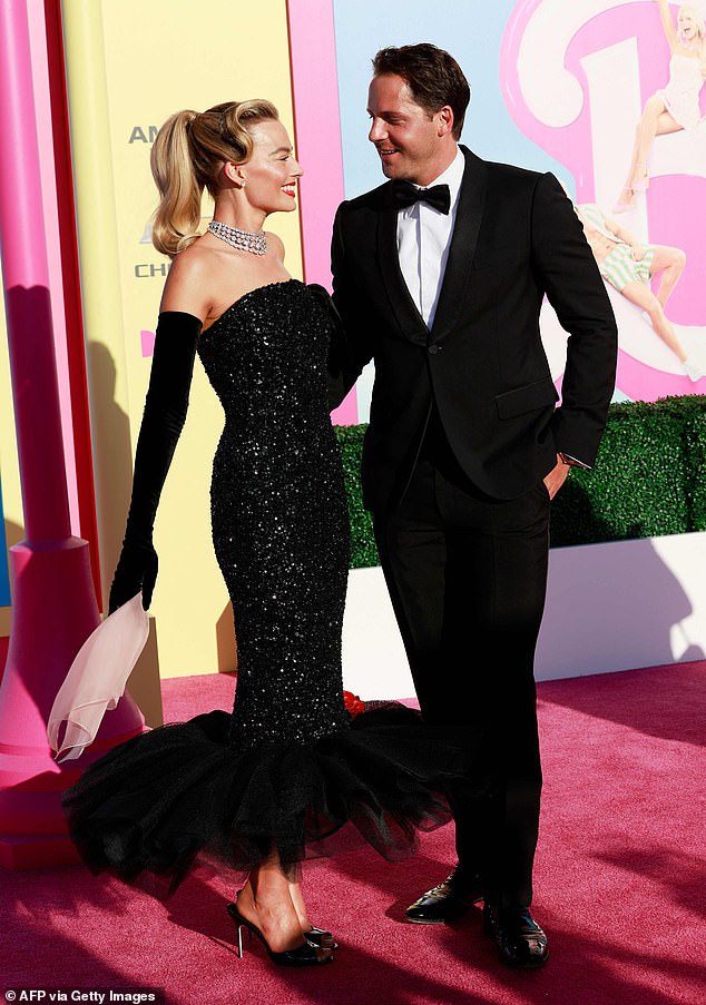 Margot was on a date with her husband, Surrey-born filmmaker Tom Ackerley, at the time (pictured together at the Barbie world premiere in July 2023).