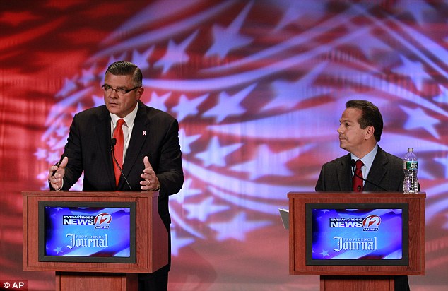 Republican congressional candidate Brendan Doherty, left, and incumbent U.S. Rep. David Cicilline, D-R., right, participate in a televised debate.