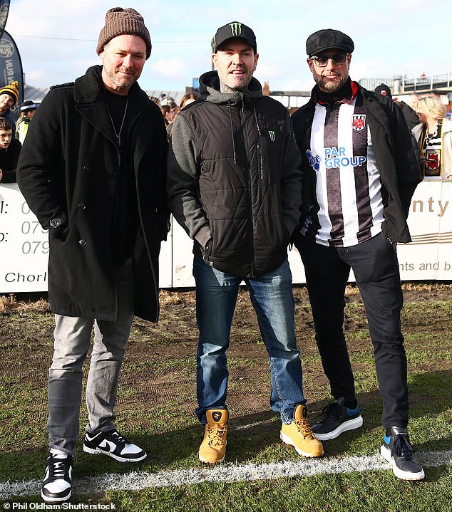 Shane and Keith (right), who proudly wore the team jersey, attended the match with Westlife's Brian McFadden.