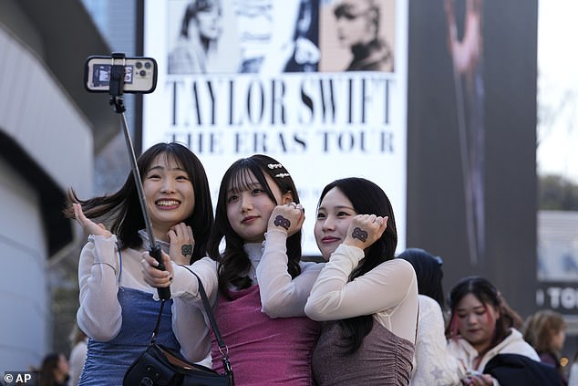 Swift fans gather outside the Tokyo Dome ahead of her Eras Tour concert on Saturday night.