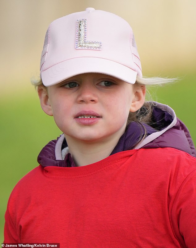 Lena sported a pink cap with a dazzling letter L emblazoned on the front.