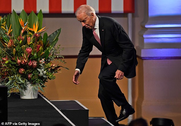 US Vice President Joe Biden stumbles as he takes the stage to deliver a speech at Paddington Town Hall in Sydney on July 20, 2016.