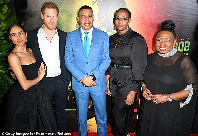 Pictured, from left to right: Meghan, Harry, Andrew, his wife Juliet and Olivia Grange, Minister of Culture, Gender, Entertainment and Sports of Jamaica.