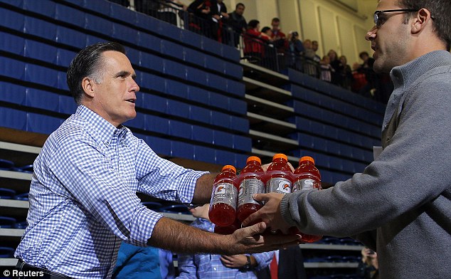 US Republican presidential candidate Mitt Romney accepts relief supplies for people affected by Hurricane Sandy.