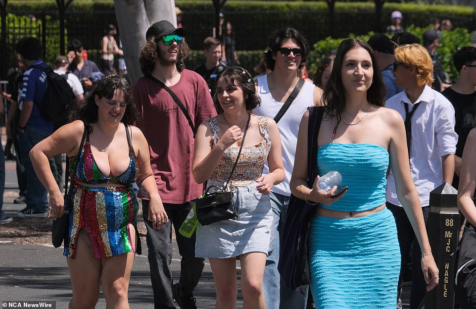 Pictured, partygoers arrive at the Laneway Festival at The Park in Flemington, Melbourne.