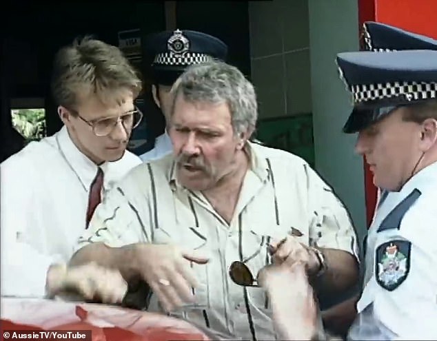 Karlson is pictured being arrested in Brisbane on October 11, 1991 in front of a television news crew.