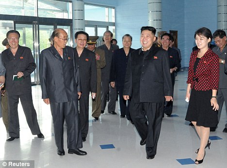 Dress to Impress: High-ranking North Koreans should wear the red lapel pins as shown in the image above.
