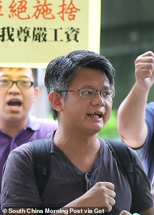 Members of the Hong Kong Confederation of Trade Unions (HKCTU), including Mung Siu-tat (foreground), attend a protest