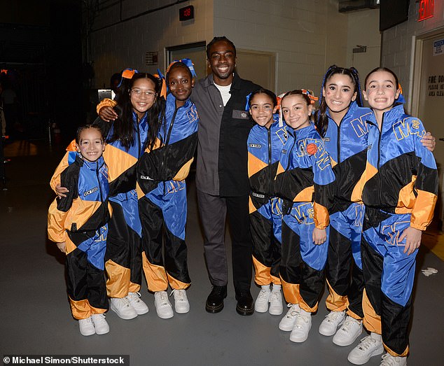 Caleb McLaughlin donned a black and gray suit while attending the game and was seen posing for a photo with the Knicks City Kids inside the spacious venue.