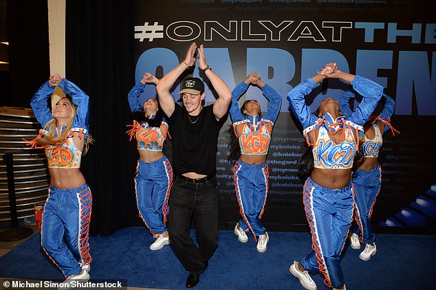 Media personality Noah Beck rocked a plain black shirt and black pants while showing off some of his dance skills with the Knicks City Dancers.