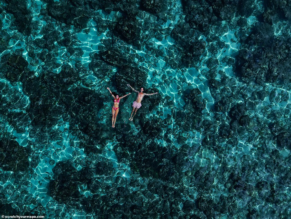 The couple uses a variety of photography equipment, including drones, to capture their stunning images. This aerial shot shows the two relaxing in the waters off Socotra, an island in the Republic of Yemen in the Indian Ocean.