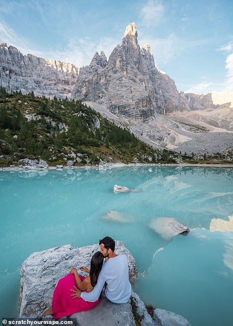 This image captures the bright blue waters of Lago di Braies, a beautiful lake in the heart of the Dolomites.