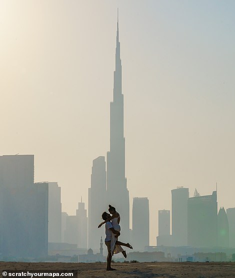 The impressive Burj Khalifa occupies the center of the photograph on the left. At 830 m (2,723 ft) tall, it is the tallest structure in the world and one of Dubai's most popular attractions.