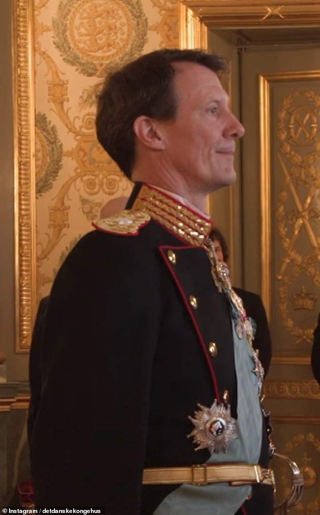 King Frederick's younger brother Prince Joachim, whose sons were stripped of their royal titles last year, looked pensive as he watched the emotional balcony scene from inside the palace.