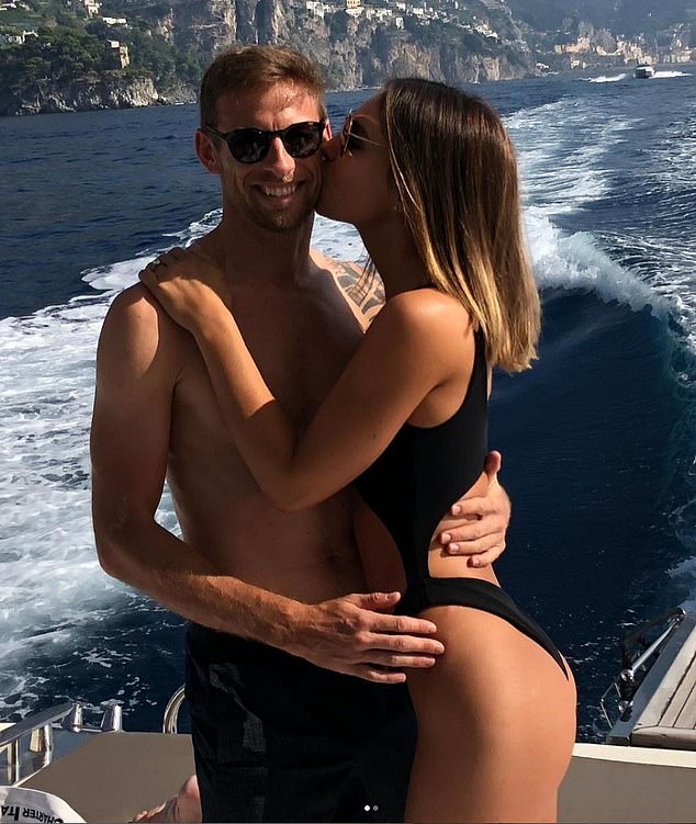 Jenson Button and his model wife Brittny Ward pose for a photo together while on vacation