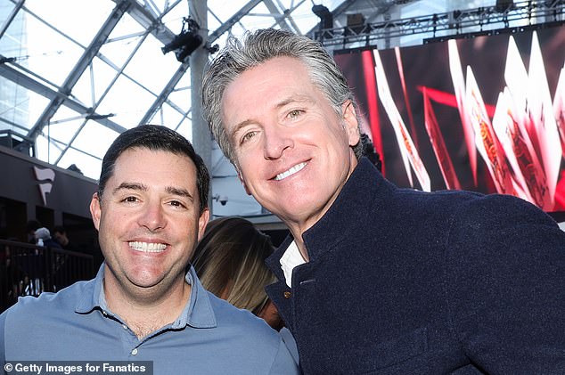 California Governor Gavin Newsom (right) appears with San Francisco 49ers CEO Jed York in Las Vegas on Saturday night as the couple attended a Super Bowl party.