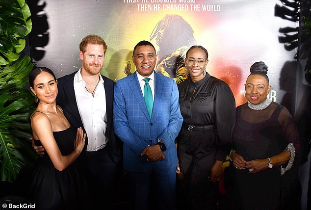 Meghan and Harry, who left royal duties four years ago, were also alongside Jamaican Prime Minister Andrew Holness (centre) and his wife Juliet at the premiere.