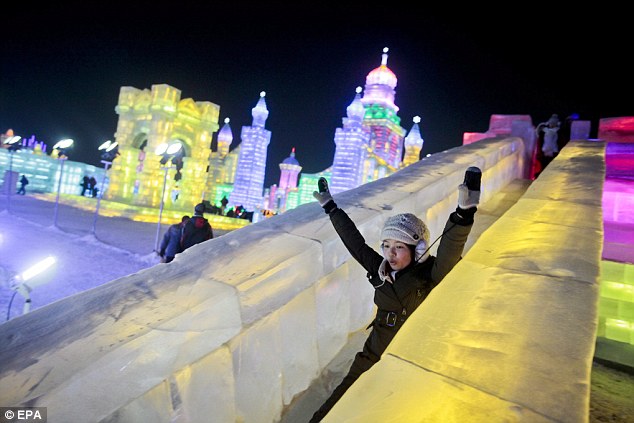 What goes up, must come down: an ice lover slides down one of the event's slides