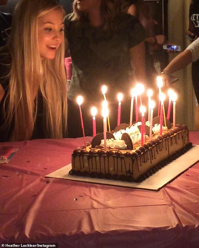 There was a picture where Ava was blowing out the pink and red candles on her chocolate birthday cake.