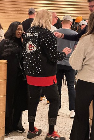 Donna was wearing a black jacket with the Chiefs logo on the back.