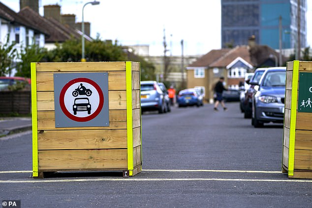 Bollards have been placed on a street in Cowley, near Oxford, to create a low-traffic neighborhood