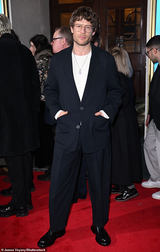 James looked incredibly dapper in an oversized black suit, while wearing a casual white t-shirt and polished black shoes.