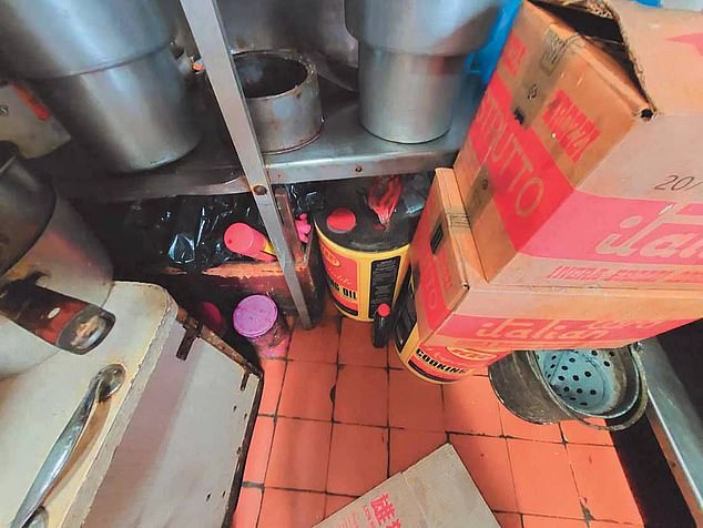 Cooking oil pictured under a shelf (pictured)